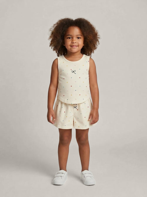 Enfant portant une tenue pois multicolores en coton – collection été – MIKID'Z